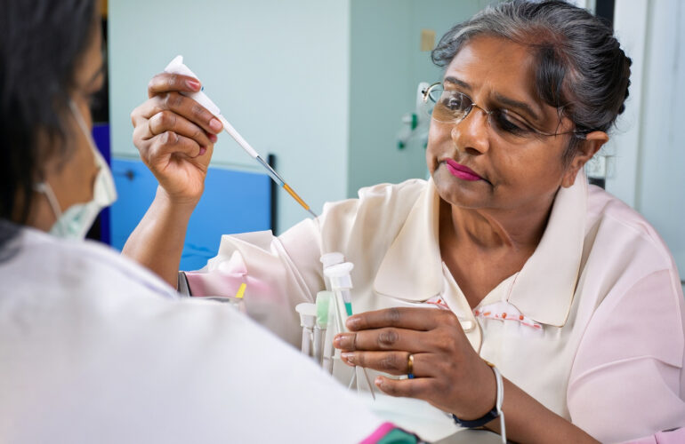 female senior citizen giving blood test in pathology lab mumbai