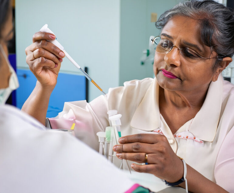 female senior citizen giving blood test in pathology lab mumbai